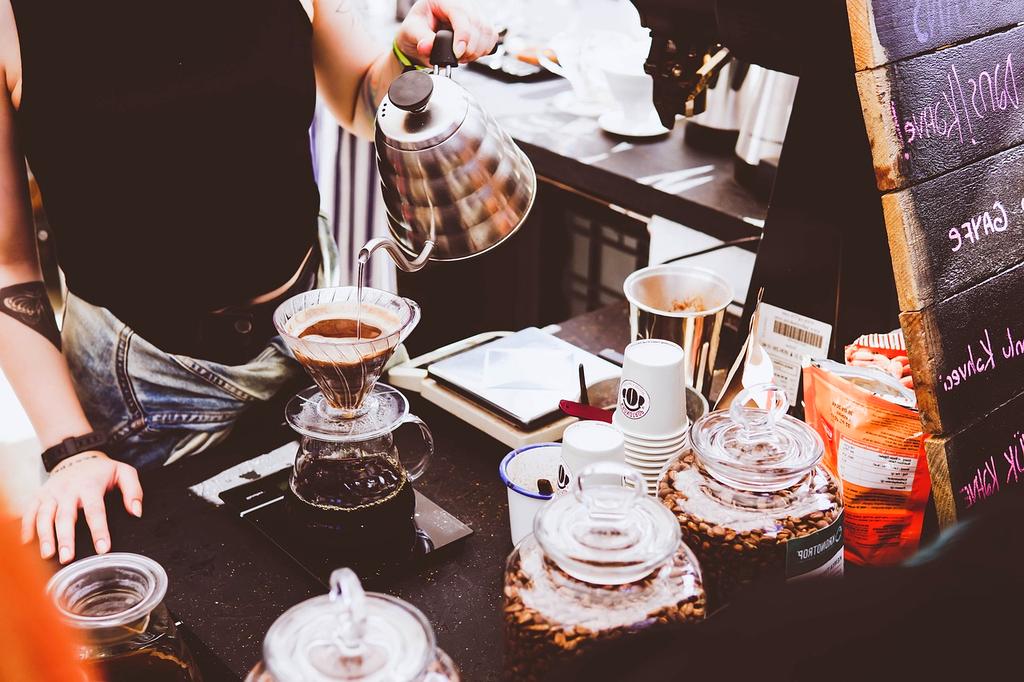 French press with fresh brewed coffee and timer